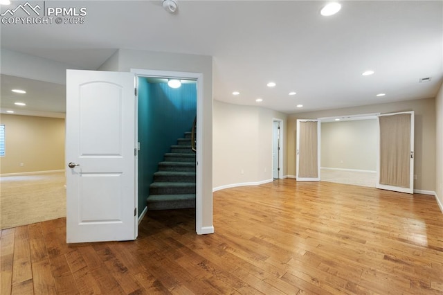 4410 Campus Bluffs Ct, Colorado Springs, CO 80918 - below grade area with stairway, wood finished floors, and recessed lighting