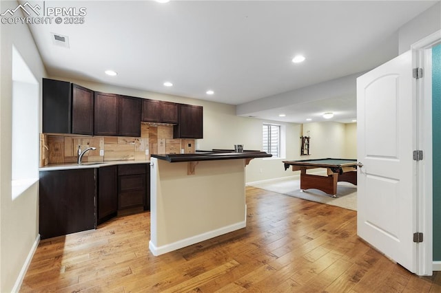 4410 Campus Bluffs Ct, Colorado Springs, CO 80918 - kitchen with a breakfast bar, dark brown cabinetry, light wood-type flooring, billiards table, and recessed lighting