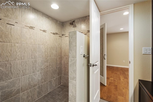 4410 Campus Bluffs Ct, Colorado Springs, CO 80918 - bathroom featuring walk in shower, wood finished floors, and recessed lighting