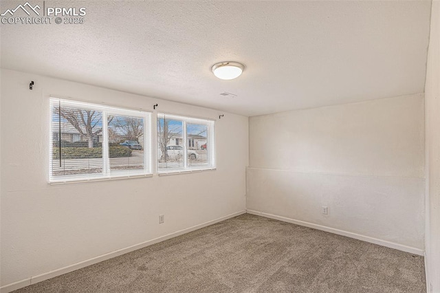 140 Schirra Pl, Pueblo, CO 81001 - unfurnished room with carpet flooring, baseboards, and a textured ceiling