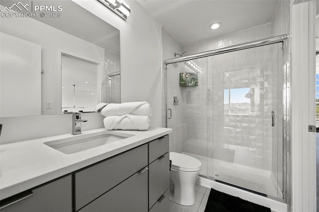 10423 Bergan Peak Ct, Colorado Springs, CO 80924 - bathroom with vanity, a shower stall, and recessed lighting