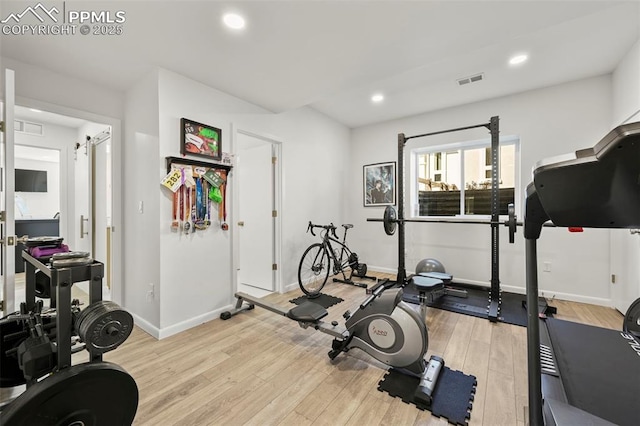 10423 Bergan Peak Ct, Colorado Springs, CO 80924 - workout area featuring light wood-style flooring and recessed lighting