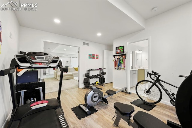 10423 Bergan Peak Ct, Colorado Springs, CO 80924 - exercise area with wood finished floors and recessed lighting