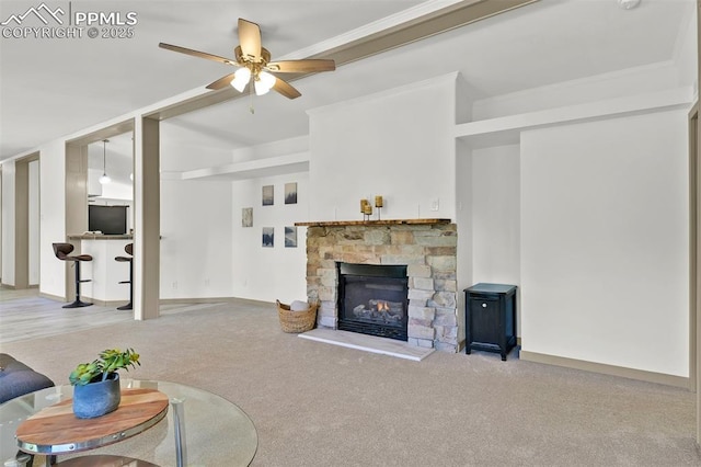 451 Fern Rd, Woodland Park, CO 80863 - carpeted living room with ceiling fan and a stone fireplace
