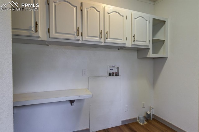 451 Fern Rd, Woodland Park, CO 80863 - laundry area featuring washer hookup, cabinet space, and dark wood finished floors