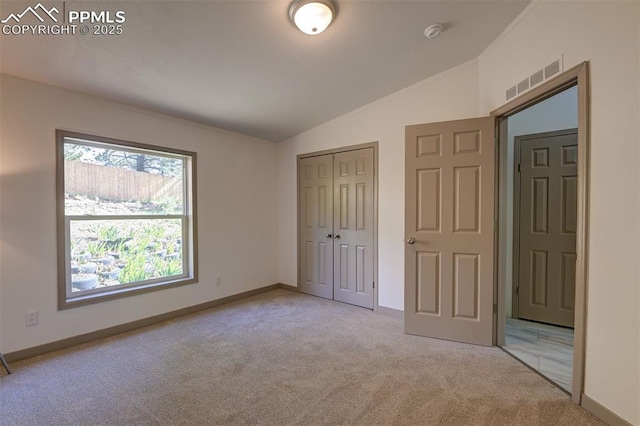 451 Fern Rd, Woodland Park, CO 80863 - unfurnished bedroom with lofted ceiling, carpet, and a closet