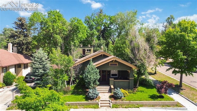 1326 E Platte Ave, Colorado Springs, CO 80909 - view of front of home with a porch and a front lawn