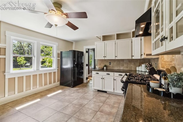 1326 E Platte Ave, Colorado Springs, CO 80909 - kitchen with black fridge with ice dispenser, exhaust hood, tasteful backsplash, and healthy amount of natural light