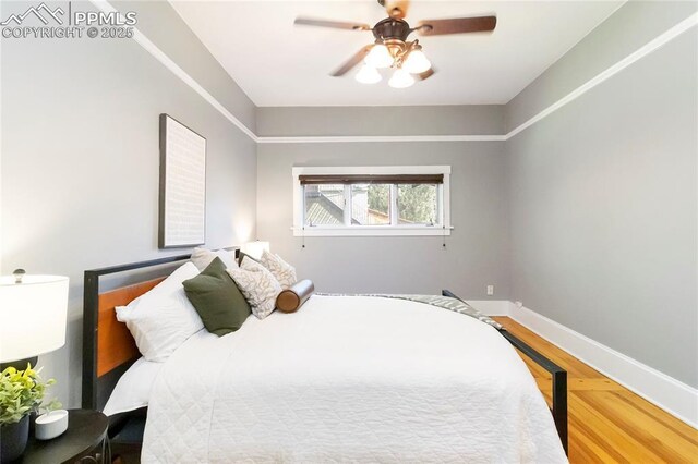 1326 E Platte Ave, Colorado Springs, CO 80909 - bedroom with wood finished floors and a ceiling fan