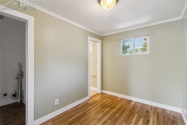 1326 E Platte Ave, Colorado Springs, CO 80909 - unfurnished bedroom featuring ornamental molding and wood finished floors