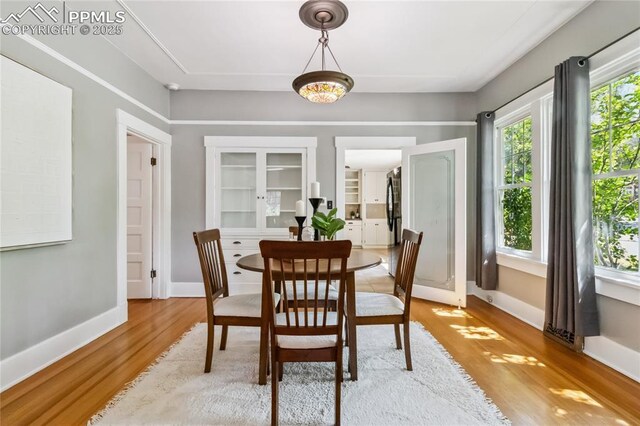 1326 E Platte Ave, Colorado Springs, CO 80909 - dining area with light wood-type flooring and baseboards