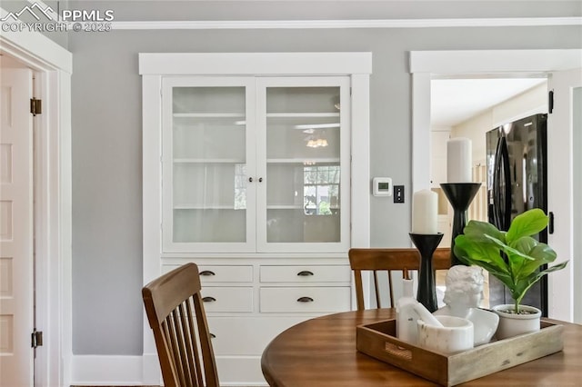 1326 E Platte Ave, Colorado Springs, CO 80909 - dining area featuring ornamental molding