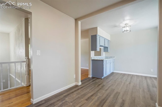 4116 Fitzpatrick Dr, Colorado Springs, CO 80909 - unfurnished living room featuring wood finished floors and baseboards