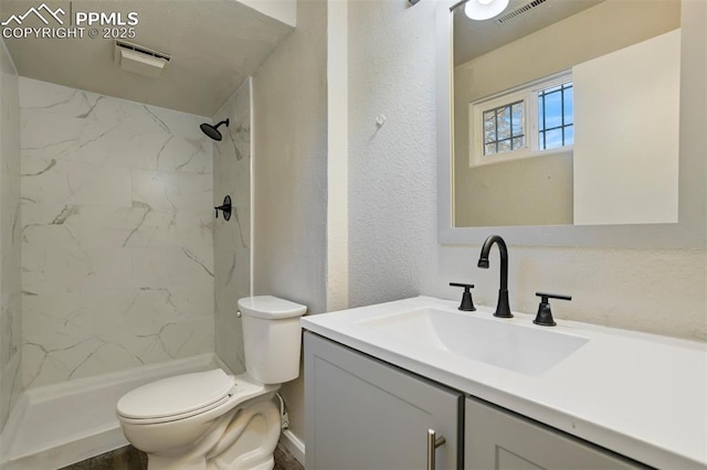 4116 Fitzpatrick Dr, Colorado Springs, CO 80909 - full bath with vanity, a marble finish shower, and a textured wall