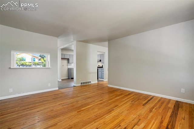 4116 Fitzpatrick Dr, Colorado Springs, CO 80909 - unfurnished living room with light wood-style floors and baseboards