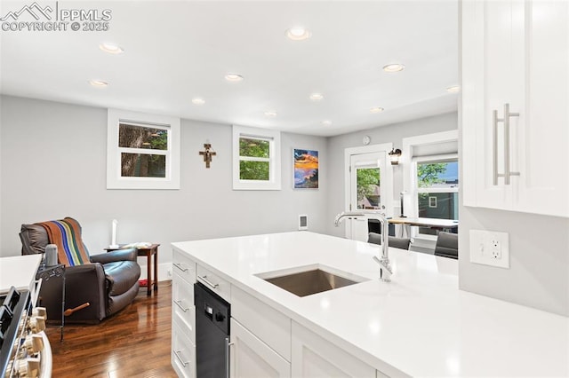 112 N 12th St, Colorado Springs, CO 80904 - kitchen with light countertops, white cabinets, dark wood-style floors, stainless steel range oven, and recessed lighting