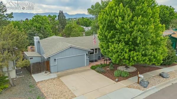 4750 Iron Horse Trl, Colorado Springs, CO 80917 - view of front of home with driveway and an attached garage