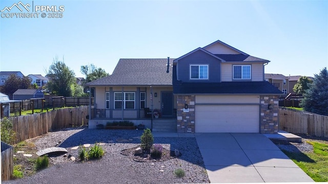 11310 Falling Star Rd, Fountain, CO 80817 - view of front of house featuring a porch, driveway, a garage, and stone siding