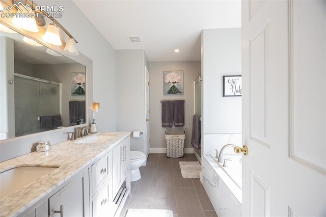 11310 Falling Star Rd, Fountain, CO 80817 - bathroom with a shower stall, recessed lighting, double vanity, and a bath