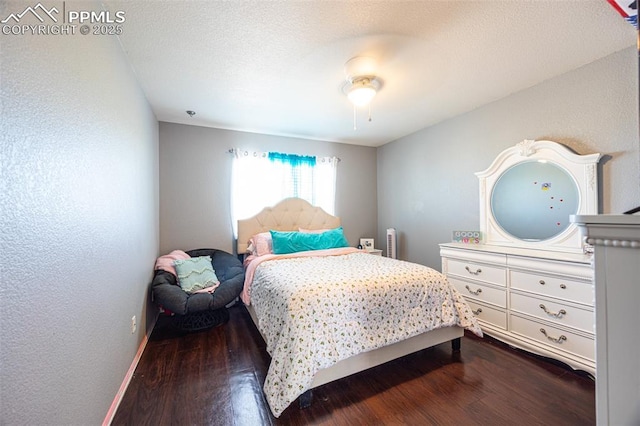 11310 Falling Star Rd, Fountain, CO 80817 - bedroom with dark wood finished floors and ceiling fan