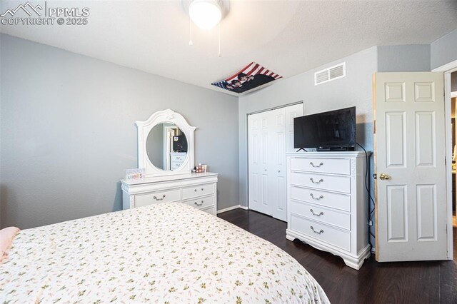 11310 Falling Star Rd, Fountain, CO 80817 - bedroom featuring dark wood-type flooring and a closet