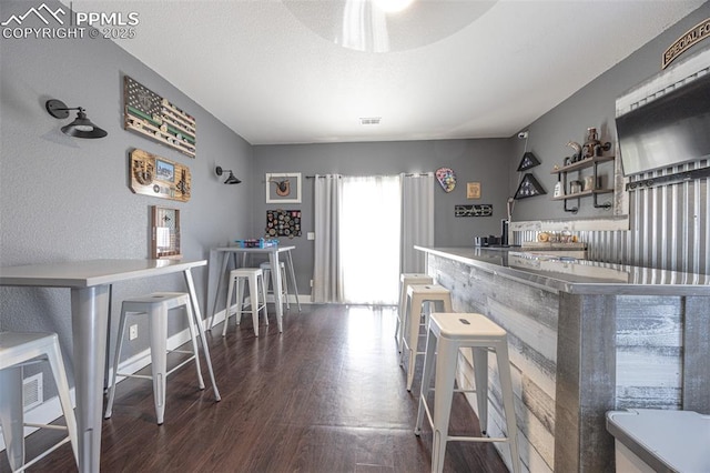 11310 Falling Star Rd, Fountain, CO 80817 - dining area with dark wood-style floors and a dry bar