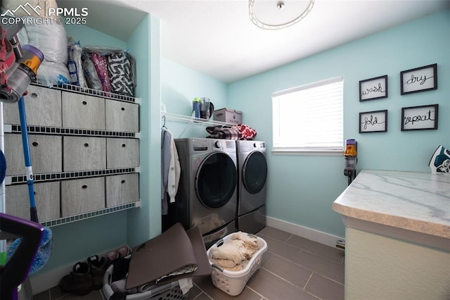 11310 Falling Star Rd, Fountain, CO 80817 - laundry room featuring washing machine and dryer and tile patterned flooring