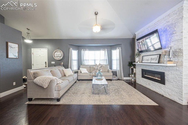 11310 Falling Star Rd, Fountain, CO 80817 - living area featuring ceiling fan, wood finished floors, a fireplace, and lofted ceiling