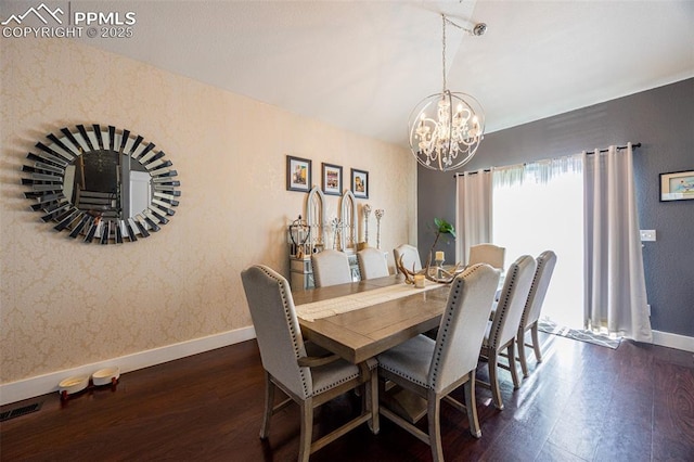 11310 Falling Star Rd, Fountain, CO 80817 - dining room featuring dark wood-style floors and a chandelier