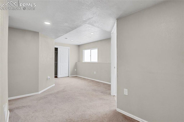 9344 Hirono Rd, Peyton, CO 80831 - spare room with carpet flooring, a textured ceiling, and recessed lighting