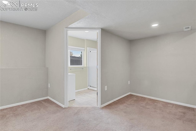 9344 Hirono Rd, Peyton, CO 80831 - empty room with carpet flooring, a textured ceiling, and recessed lighting