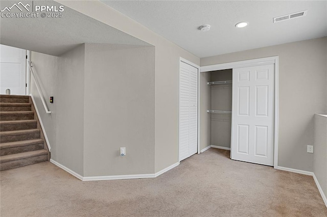 9344 Hirono Rd, Peyton, CO 80831 - unfurnished bedroom featuring carpet floors, a closet, a textured ceiling, and recessed lighting