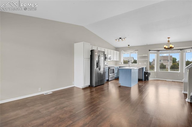 9344 Hirono Rd, Peyton, CO 80831 - kitchen featuring appliances with stainless steel finishes, white cabinets, a chandelier, light countertops, and dark wood finished floors