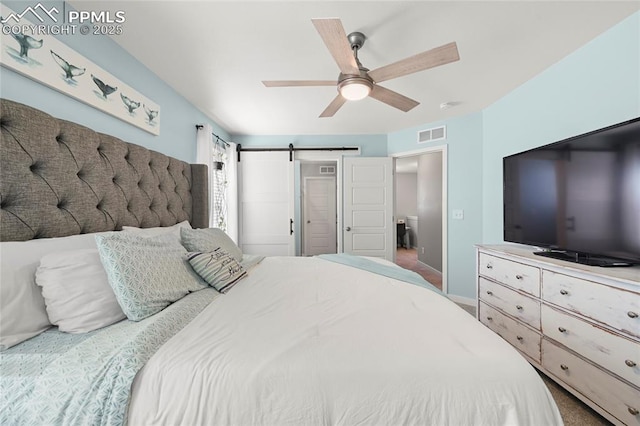 6125 Ashmore Ln, Colorado Springs, CO 80927 - bedroom with a barn door and a ceiling fan