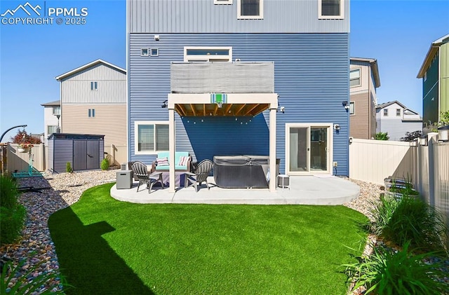 6125 Ashmore Ln, Colorado Springs, CO 80927 - rear view of property featuring a hot tub, a patio, a fenced backyard, and a balcony