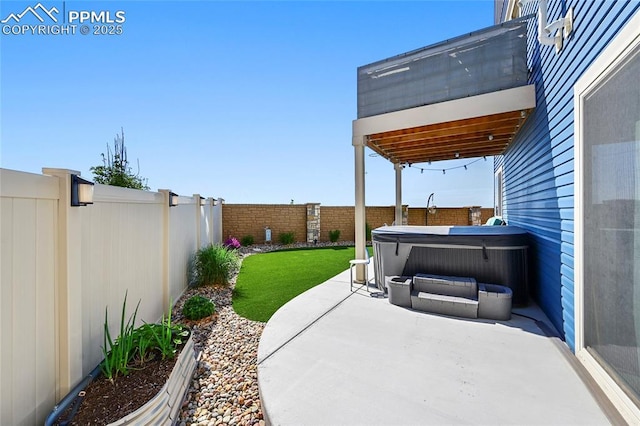 6125 Ashmore Ln, Colorado Springs, CO 80927 - fenced backyard featuring a hot tub and a patio