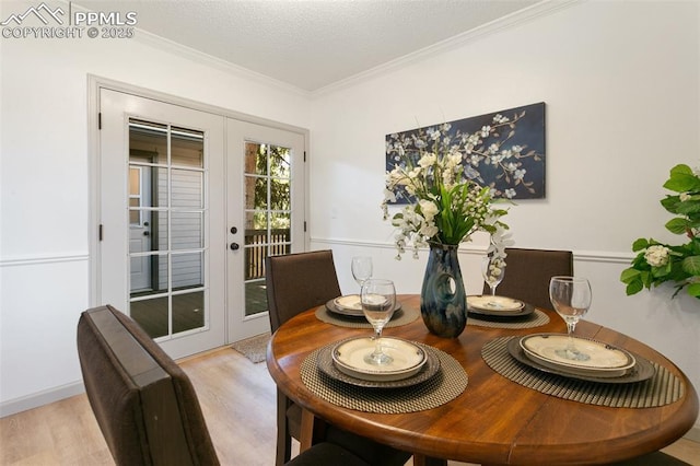 2838 Shadowglen Dr, Colorado Springs, CO 80918 - dining area with crown molding, wood finished floors, and french doors