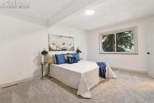 2838 Shadowglen Dr, Colorado Springs, CO 80918 - bedroom with carpet floors and beam ceiling