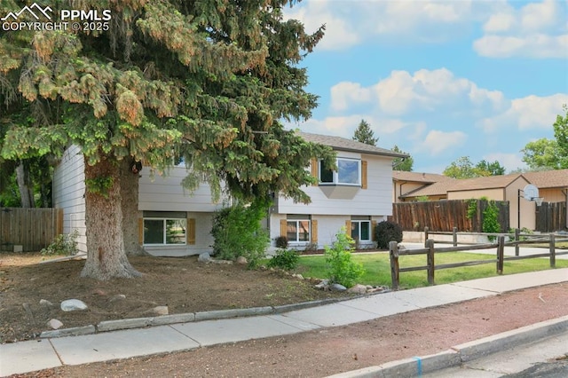 2838 Shadowglen Dr, Colorado Springs, CO 80918 - split level home with a fenced front yard