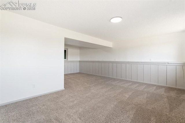 2838 Shadowglen Dr, Colorado Springs, CO 80918 - carpeted empty room with a wainscoted wall