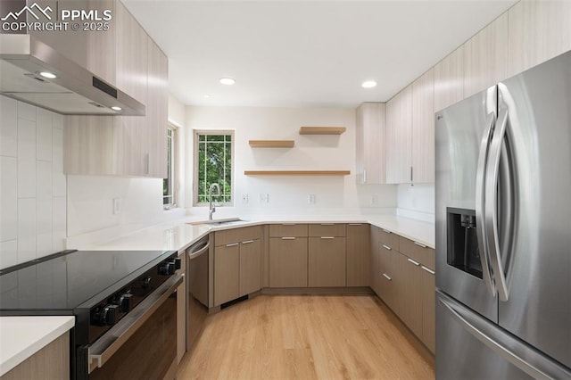 702 Crown Ridge Dr, Colorado Springs, CO 80904 - kitchen with stainless steel appliances, wall chimney exhaust hood, light wood-type flooring, light countertops, and recessed lighting
