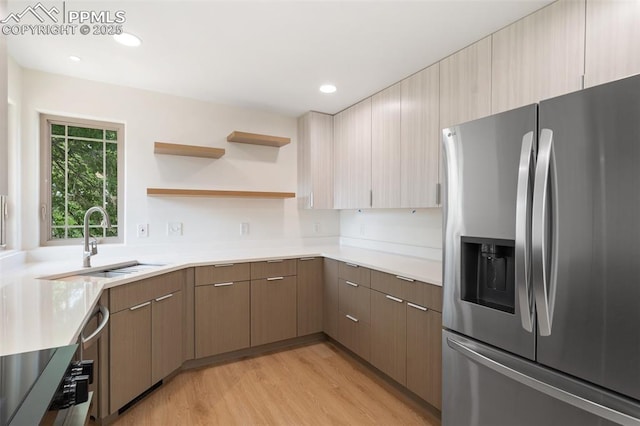 702 Crown Ridge Dr, Colorado Springs, CO 80904 - kitchen with stainless steel fridge, light wood-style flooring, light countertops, open shelves, and recessed lighting