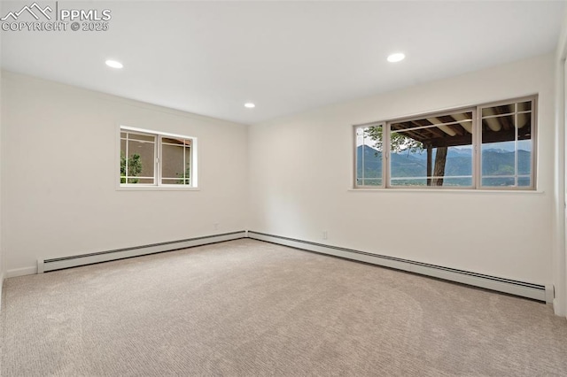 702 Crown Ridge Dr, Colorado Springs, CO 80904 - empty room featuring a baseboard heating unit, carpet flooring, and recessed lighting