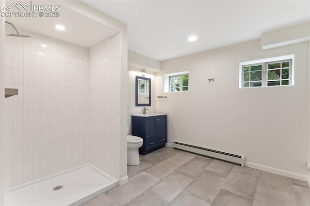 702 Crown Ridge Dr, Colorado Springs, CO 80904 - bathroom featuring a baseboard heating unit, vanity, tiled shower, and recessed lighting
