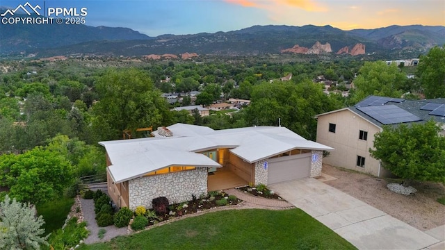 702 Crown Ridge Dr, Colorado Springs, CO 80904 - aerial view at dusk of a mountain view