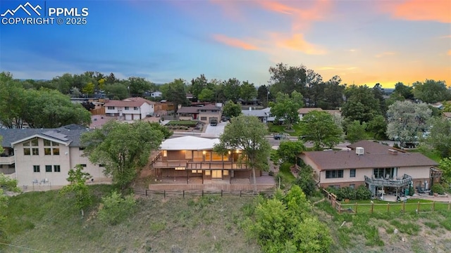 702 Crown Ridge Dr, Colorado Springs, CO 80904 - aerial perspective of suburban area featuring a tree filled landscape