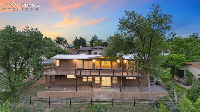 702 Crown Ridge Dr, Colorado Springs, CO 80904 - rear view of property with a patio, a wooden deck, and a fenced backyard