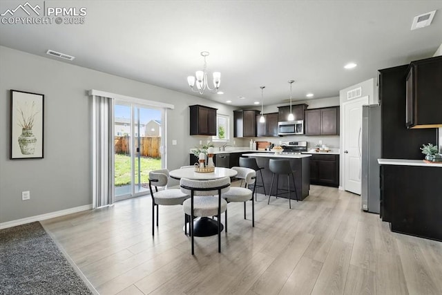 7791 Berwyn Loop, Peyton, CO 80831 - dining room with light wood finished floors, a chandelier, and recessed lighting