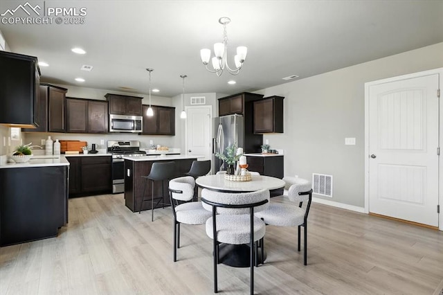 7791 Berwyn Loop, Peyton, CO 80831 - dining room featuring a chandelier, light wood-style floors, and recessed lighting