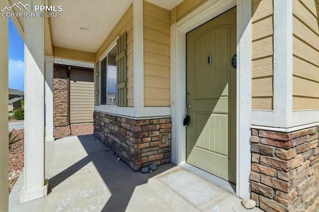 7791 Berwyn Loop, Peyton, CO 80831 - entrance to property with a porch and brick siding